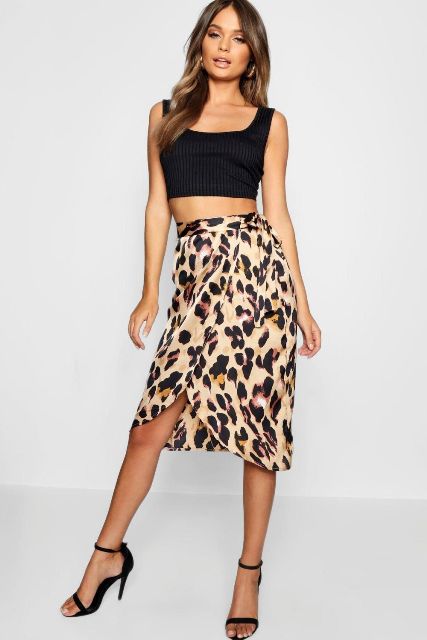With black crop top and black ankle strap heels