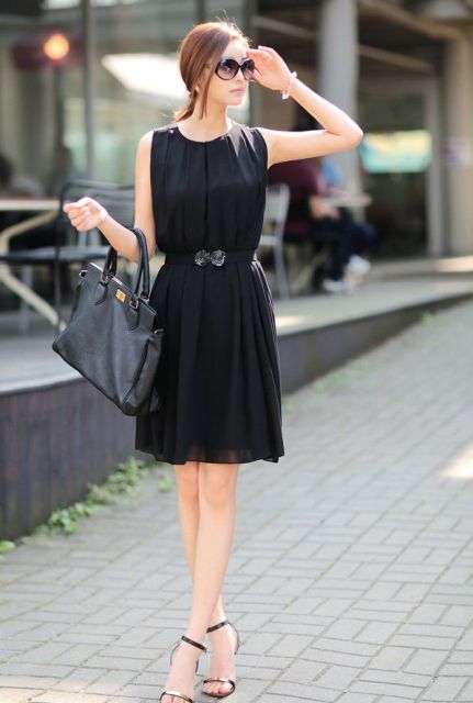 With black leather bag and ankle strap shoes