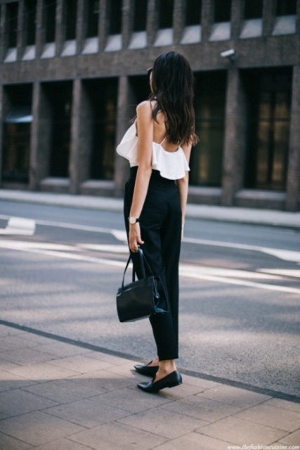 With black trousers, black bag and flat shoes