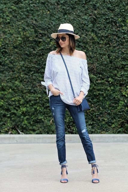 With off the shoulder blouse, hat, skinny jeans and crossbody bag