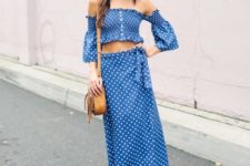 With polka dot off the shoulder top and brown bag