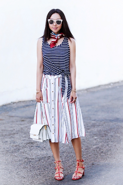 With striped midi skirt, white bag and red embellished shoes