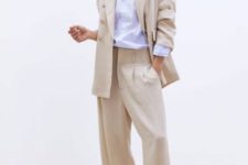 With white button down shirt, beige long blazer and black flat sandals