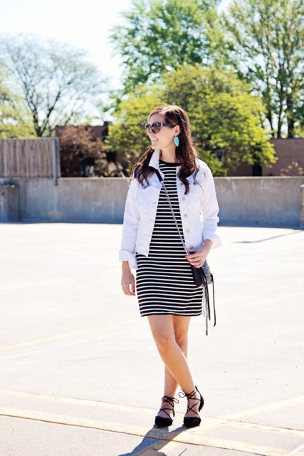 With white jacket, chain strap bag and lace up flats