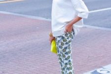 With white loose shirt, yellow clutch and pale pink pumps