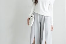 With white one shoulder shirt, white clutch and white sneakers