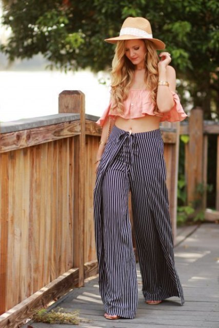 With wide brim hat, striped wide leg pants and heels