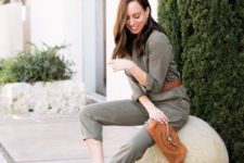 a grey boiler suit styled with a brown belt, clutch and block heels for a party or work