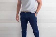 a grey polo shirt, navy pants, white sneakers will make up a cool work outfit with a sporty feel
