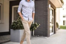 a light blue button down, tan cropped pants, grey sneakers for a comfortable summer outfit