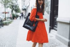 a red off the shoulder A-line knee dress, checked slipper mules and a black tote