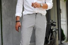 a white button down, grey pants, white sneakers for a chic yet casual work outfit