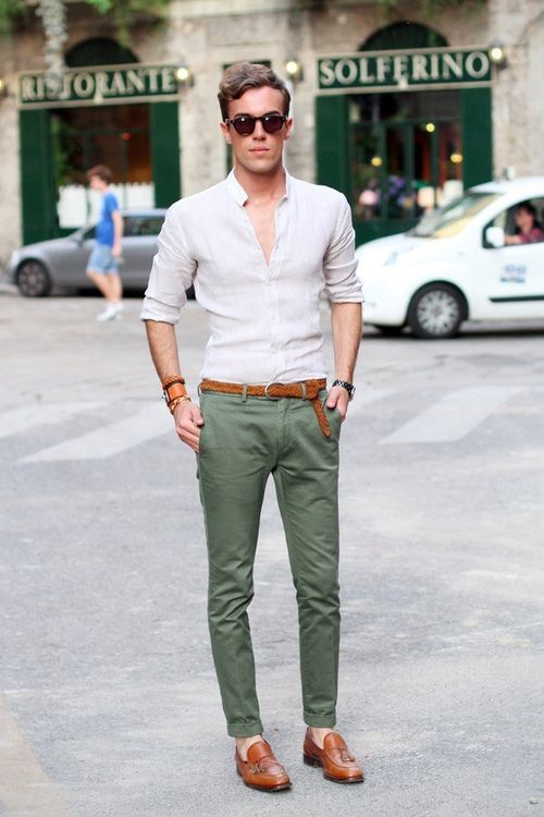 an off-white shirt, olvie green pants, brown loafers and a matching belt for a chic and comfy look