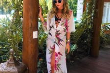 02 a black strappy bikini and a white long floral kimono contrast with each other and look very bold