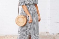 02 a feminine outfit with a black and white off the shoulder striped midi dress, a round straw bag and tan slippers