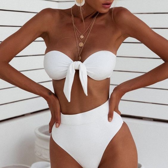 a classic white bikini with a strapless knot top and a high waisted and high cut leg bottom