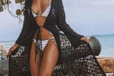 07 a monochromatic look with a striped black and white bikini, a black crochet coverup, a straw hat