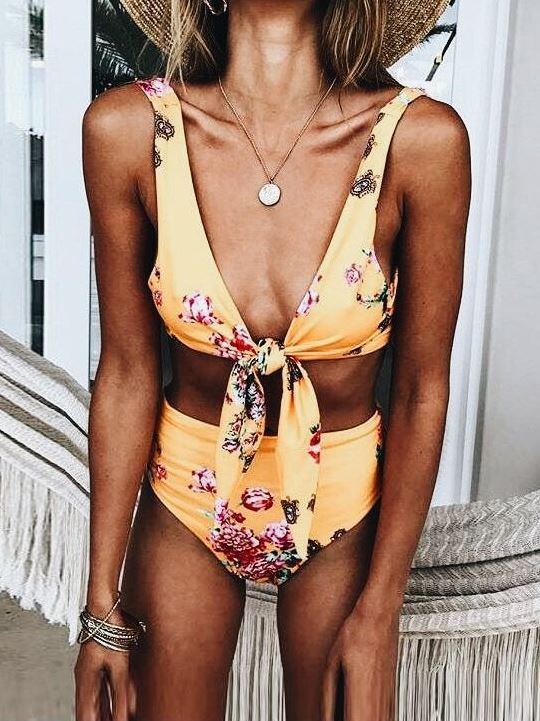 a sunny yellow bikini with a high waisted bottom and knot thick strap top