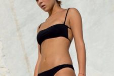 08 a minimalist black bikini with a laconic top that shows off a cool design with laces and a simple bottom