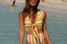 09 a retro-inspired striped yellow and white bikini with a thick strap top with a knot and a high waisted bottom