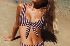 10 a retro-inspired striped bikini with a thick strap top and a knot and a high waisted bottom