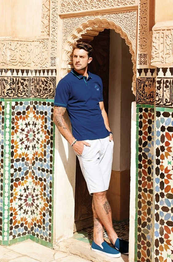a navy polo shirt, grey shorts, navy loafers for a masculine and very comfortable look