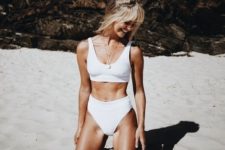 14 a simple and minimal white bikini with thick straps and a scoop neckline and a high waisted bottom