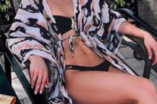 15 an abstract print beach kimono perfectly matches the black bikini and makes it look cooler