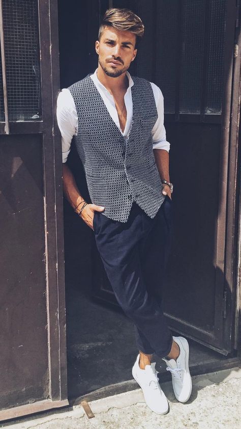 elegant summer work outfit with a white button up, a printed waistcoat, navy pants and white sneakers