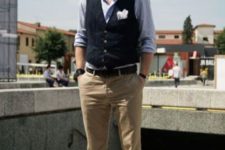 16 a smart casual look with a blue shirt, a navy waistcoat, tan pants, brown loafers and a handkerchief