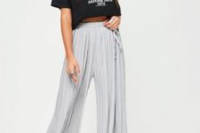 With black labeled crop t-shirt and silver sneakers