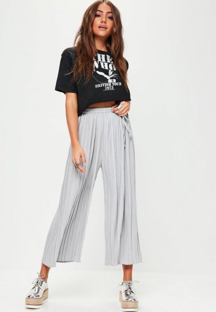 With black labeled crop t-shirt and silver sneakers