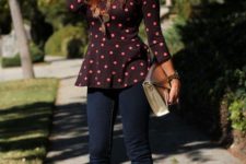 With dark colored jeans, pink high heels and golden clutch