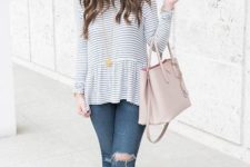 With distressed jeans, light pink bag and high heels