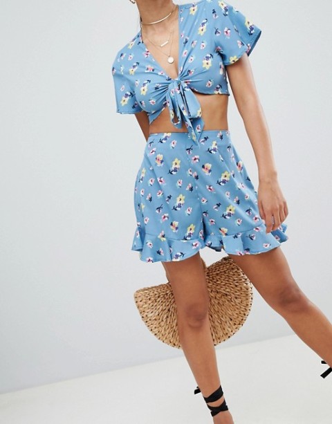 With floral crop top, black lace up shoes and straw bag