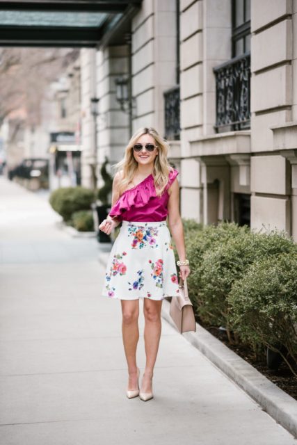 With floral skirt, beige pumps and beige bag
