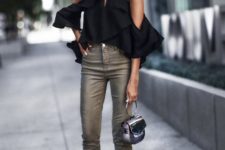 With gray cropped pants and black small bag
