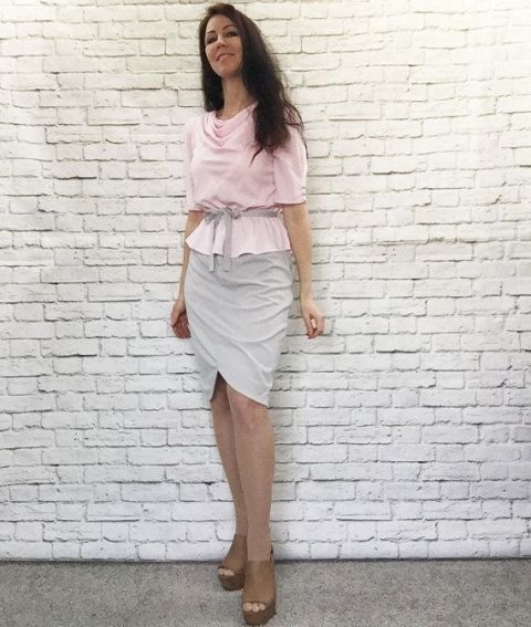 With gray wrapped skirt and platform sandals