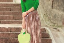With green shirt, metallic pleated skirt and white platform sandals