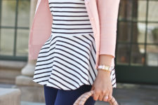 With pale pink jacket, jeans and pale pink bag