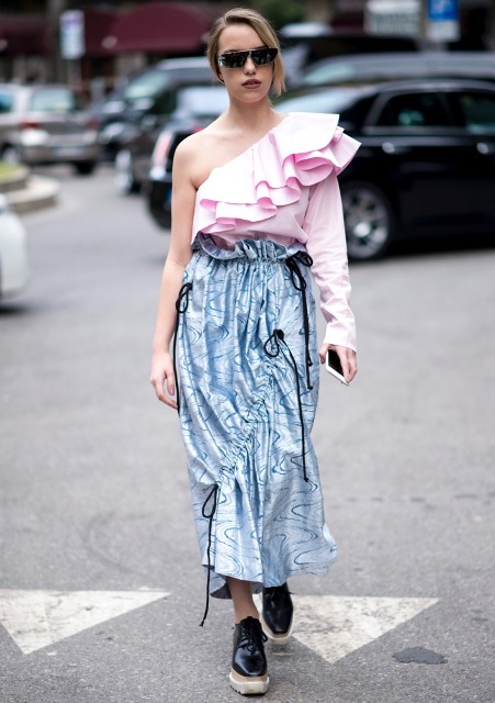 With pale pink one shoulder ruffled blouse and black platform shoes