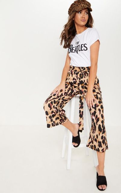With t-shirt, leopard cap and black low heeled mules