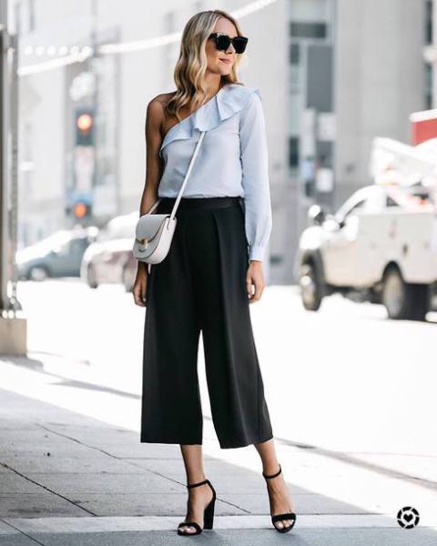 With white bag, black culottes and black ankle strap shoes