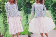 With white pleated skirt and golden and blue shoes