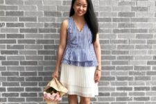 With white pleated skirt and white shoes