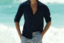 blue and white horizontal stripe trunks paired with a navy shirt will create a chic beach look