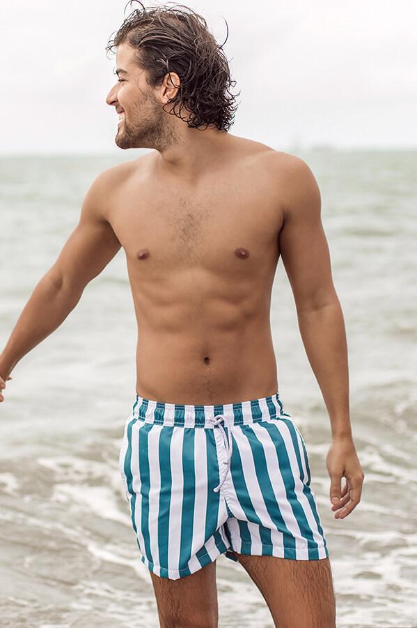 teal and white vertical stripe trunks are a fresh take on a traditional navy and white color scheme
