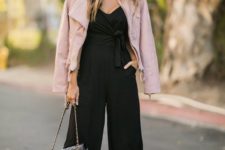 02 a black culotte jumpsuit with wideleg pants, black heels, a pink leather jacket and a black bag