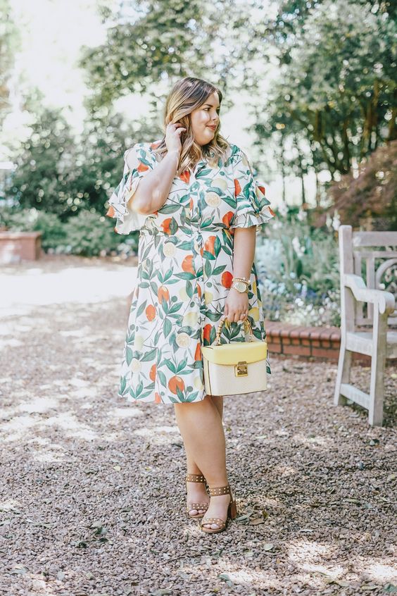 a retro print wrap midi dress with short cutout sleeves and a neutral bag will prevent you from overheating