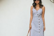 10 a striped blue and white midi dress with buttons, amber mules and a brown round bag